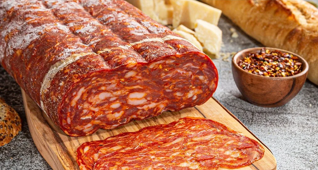 Casa Italia soppressata, sliced on a wooden board
